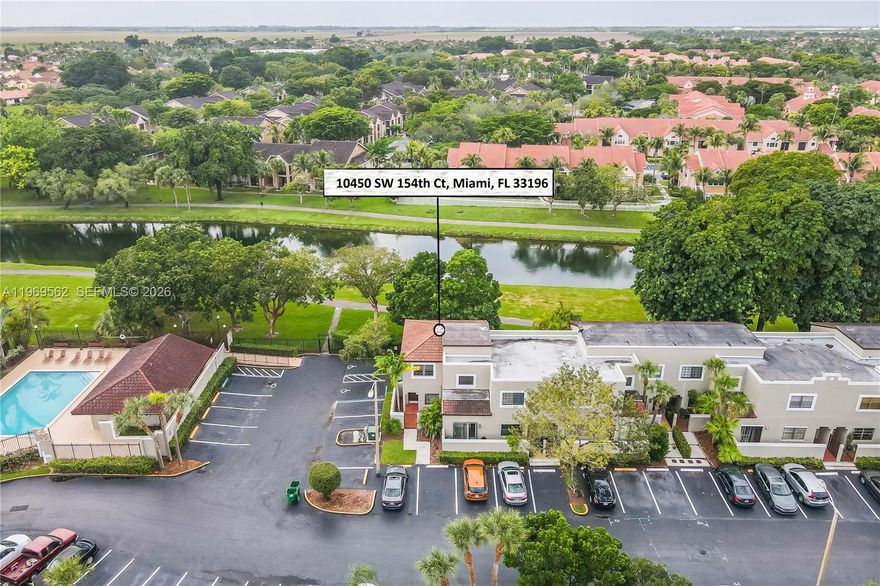 Beautifully updated 3br, 2.5ba townhouse in Palm Point. Freshly painted and move-in ready, this home features a renovated kitchen and baths, stainless steel appliances, spacious living areas, and a primary suite with custom closet. Enjoy a private balcony overlooking the canal and direct access to the scenic 11-mile Hammocks Trail—perfect for walking, jogging, or biking. Located just steps from the community pool for added convenience. The Hammocks Community offers exceptional amenities including multiple pools, clubhouses, fitness centers, tennis and basketball courts, playgrounds, and miles of lakeside paths surrounded by lush landscaping.