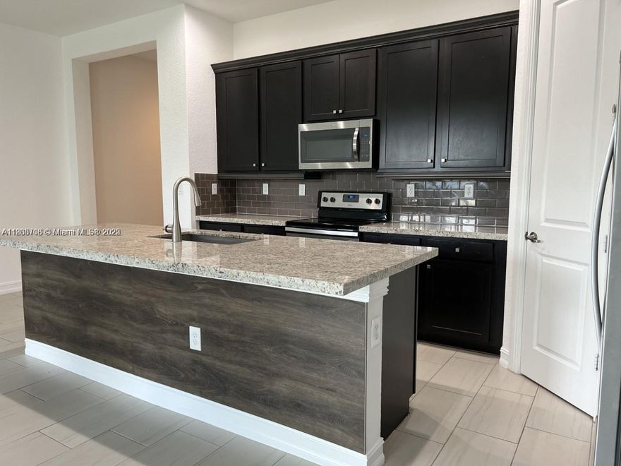 Beautiful 3 bedroom 2.5 bathroom 2 story townhouse. Open space kitchen, granite countertops, stainless steel appliances, big pantry, 2 walking closets on master bedroom, dual sinks, plenty of closets, second floor laundry, high impact windows, new tile throughout first floor & laminated flooring on stairs & second floor. Unit has a nice covered patio with garden view. Master bedroom balcony overlooks the garden & background lake. 2 car garage with 2 parking driveway. Freshly painted. This gated community offers full amenities. Pet friendly. Great schools. Centrally located, easy access to I-75, Turnpike, Pembroke Pines Mall,Garden Mall,shopping centers, Memorial Hospital & much more.Easy to show it.