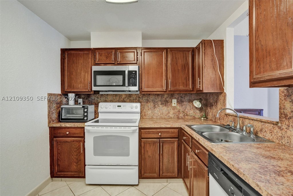 Photo of 10777 W Sample Rd #616, Coral Springs, FL 33065 (MLS # A12109350)