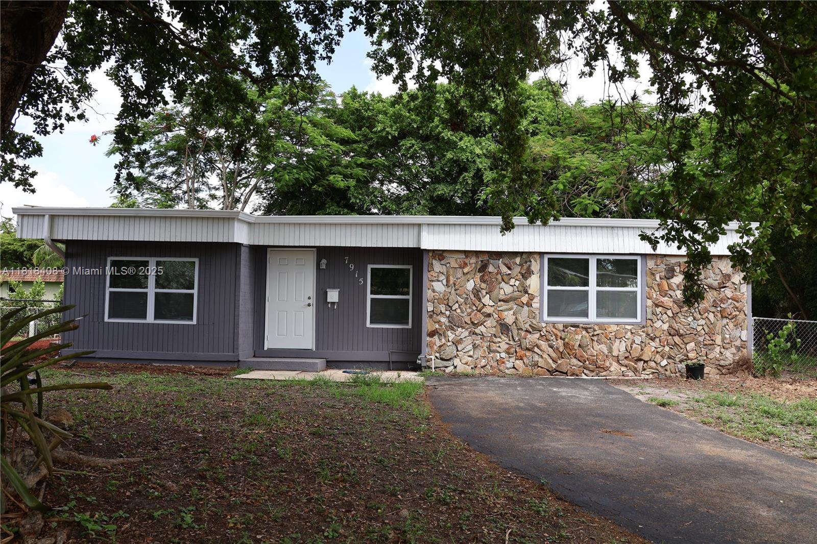 Move in ready! Beautifully renovated 4 bedroom, 2 bathroom home. Hurricane proof windows and doors all throughout the house, very energy efficient. Spacious living area, brand new vinyl flooring, fully remodeled bathrooms, all new kitchen appliances including washer and dryer, ample light fixtures with ceiling fans. Florida converted to an extra large master bedroom that is equipped with a brand new a/c and en-suite bathroom. Nestles in a large corner lot, fenced for privacy, ideal for relaxing and hosting gatherings. A perfect home to raise a family. Walking distance to Tamarac Elementary School and others. Community offers a swimming pool, club house, tennis court and a playground. No HOA application required. AVAILABLE NOW!