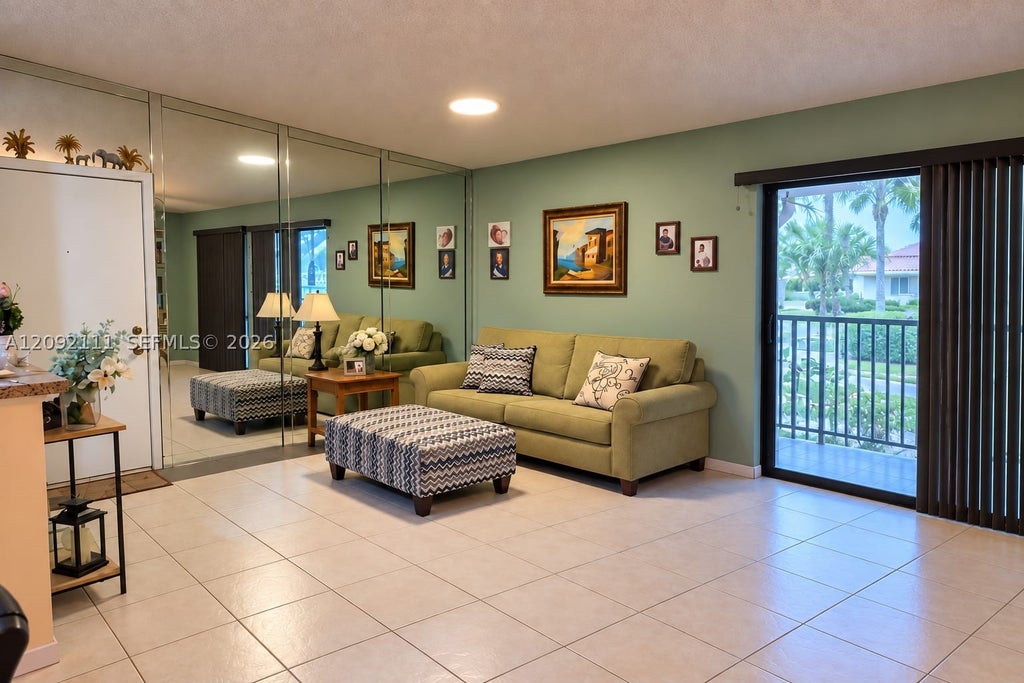 Photo of 10951 W Clairmont Cir #209, Tamarac, FL 33321 (MLS # A12092111)