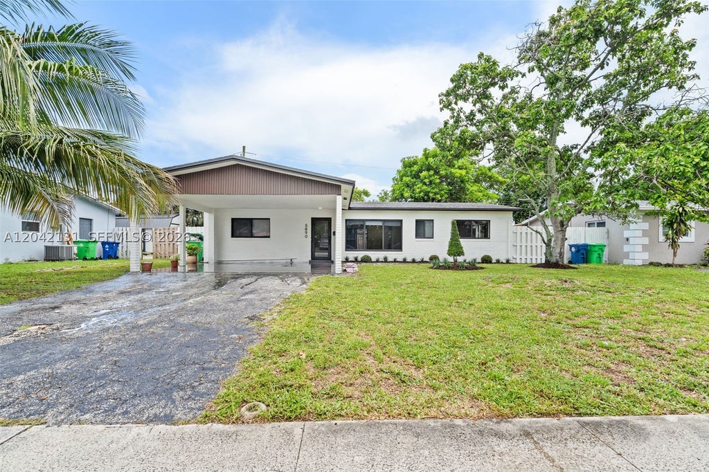 Photo of 5890 NW 15th St, Sunrise, FL 33313 (MLS # A12042131)