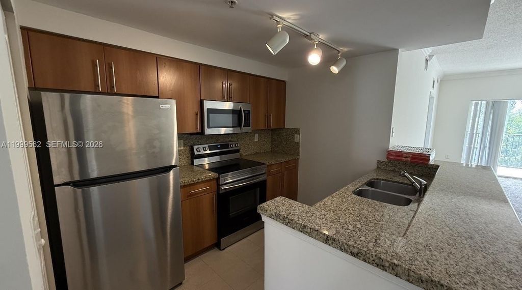 Photo of 5800 W Sample Rd #307, Coral Springs, FL 33067 (MLS # A11999562)