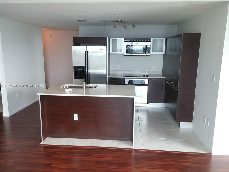 Spacious and modern 2-bedroom, 2-bath condo with beautiful wood floors throughout and a bright open-concept kitchen featuring stainless steel appliances. Enjoy walk-in closets and a large wraparound balcony with breathtaking skyline views. Rent includes water and high-speed internet! Quantum offers resort-style amenities, including two pools, a movie theater, pool tables, cyber lounge, two-story gym, yoga room, and a resident lounge. Perfectly located in the heart of Edgewater Miami, right across from Margaret Pace Park with a playground, outdoor gym, BBQ grills, and courts for basketball, tennis, and volleyball.