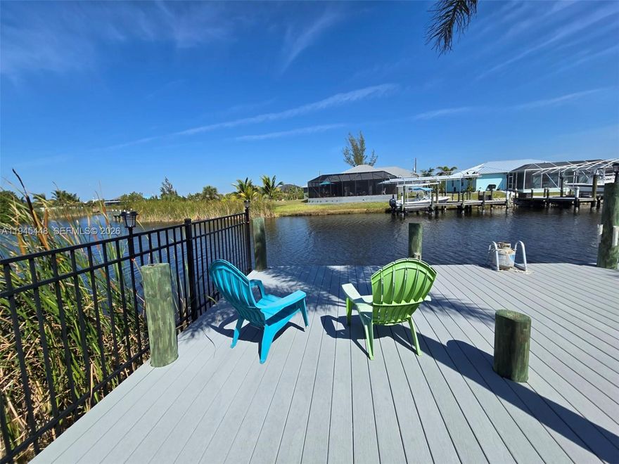 Welcome home to paradise, where every day feels like a Florida vacation. This beautifully maintained waterfront home impresses from the moment you arrive, featuring a columned entry with double doors and an arched window. Inside, the main living area opens to stunning views of the Appleton Waterway through expansive sliding glass doors, seamlessly blending indoor and outdoor living.

Designed for entertaining, the screened lanai showcases a large kidney-shaped heated spa and overlooks the canal and private boat dock. The light-filled dining room features an arched window, while the open family room  display shelving for your favorite pieces.

The gourmet kitchen is a chef’s dream with granite countertops, wood cabinetry, stainless steel appliances, and a center island wet bar with separate sink—all with picturesque water views. The spacious primary suite provides a private retreat with lanai access, a soaking tub, oversized walk-in glass shower, and dual granite vanities.

A split-bedroom floor plan includes two additional bedrooms and a full bath, plus a versatile flex room ideal for an office, study, or studio. Boaters will love having a private dock just steps away, ready for impromptu days on the water.

Located in the desirable waterfront community of South Gulf Cove, this home is close to shopping, dining, golf courses, Englewood, Punta Gorda, Fisherman’s Village, and the stunning beaches of Boca Grande—just a short boat ride or quick drive away.