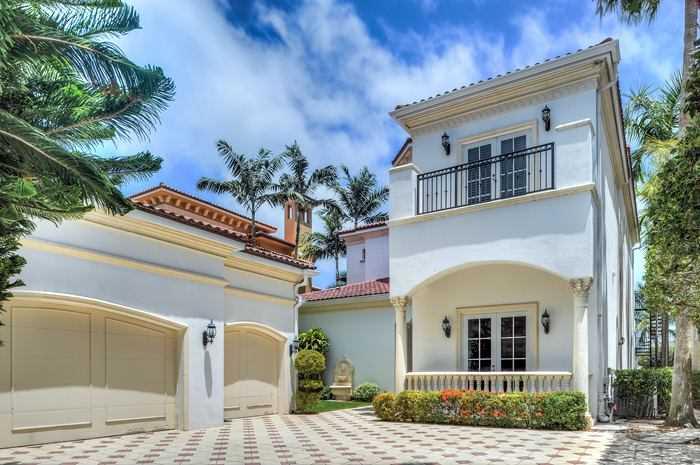 Expansive private residence on exclusive gated Island Estates. Magnificent panoramic views of the Intracoastal from gourmet kitchen & all living areas. Great for entertaining w/ open floor plan, high ceilings, formal dining & custom bar. 5bd/5.5ba (3 up, 2 down) Luxurious master w/ walk-in closets, tremendous master bath, oversized terrace all w/ water views. Pool area w/ spa, summer kitchen & lg deck. Dock your boat (up to 60 feet) in private marina steps away from your front door.