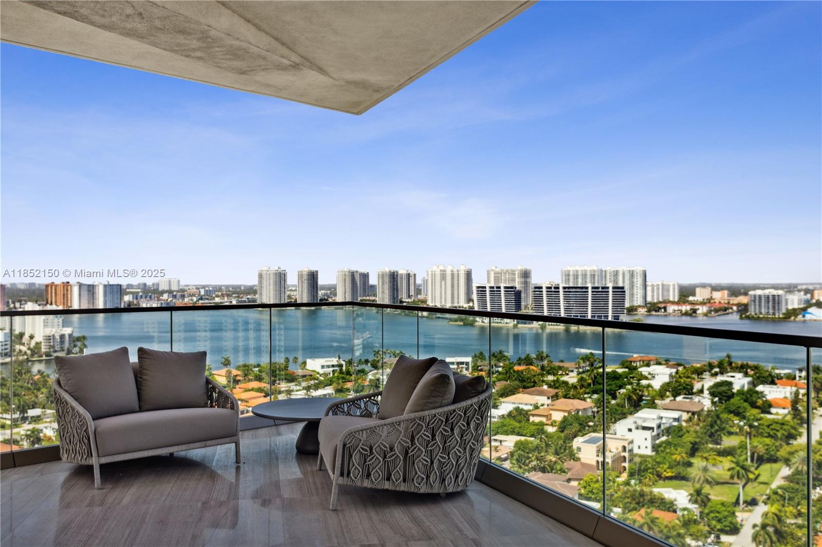 Features a vast wrap around balcony with breathtaking views, designed to enjoy the best sunsets! This apartment comprises 2 bedrooms, both en suite, and a cozy and light living space with ocean and bay views. Elegantly furnished by Artefacto Miami, closets by Ornare and electric shades in all bedrooms and in the masterbathroom. This ocean front building offers the advantage of enjoying superb exclusive amenities.