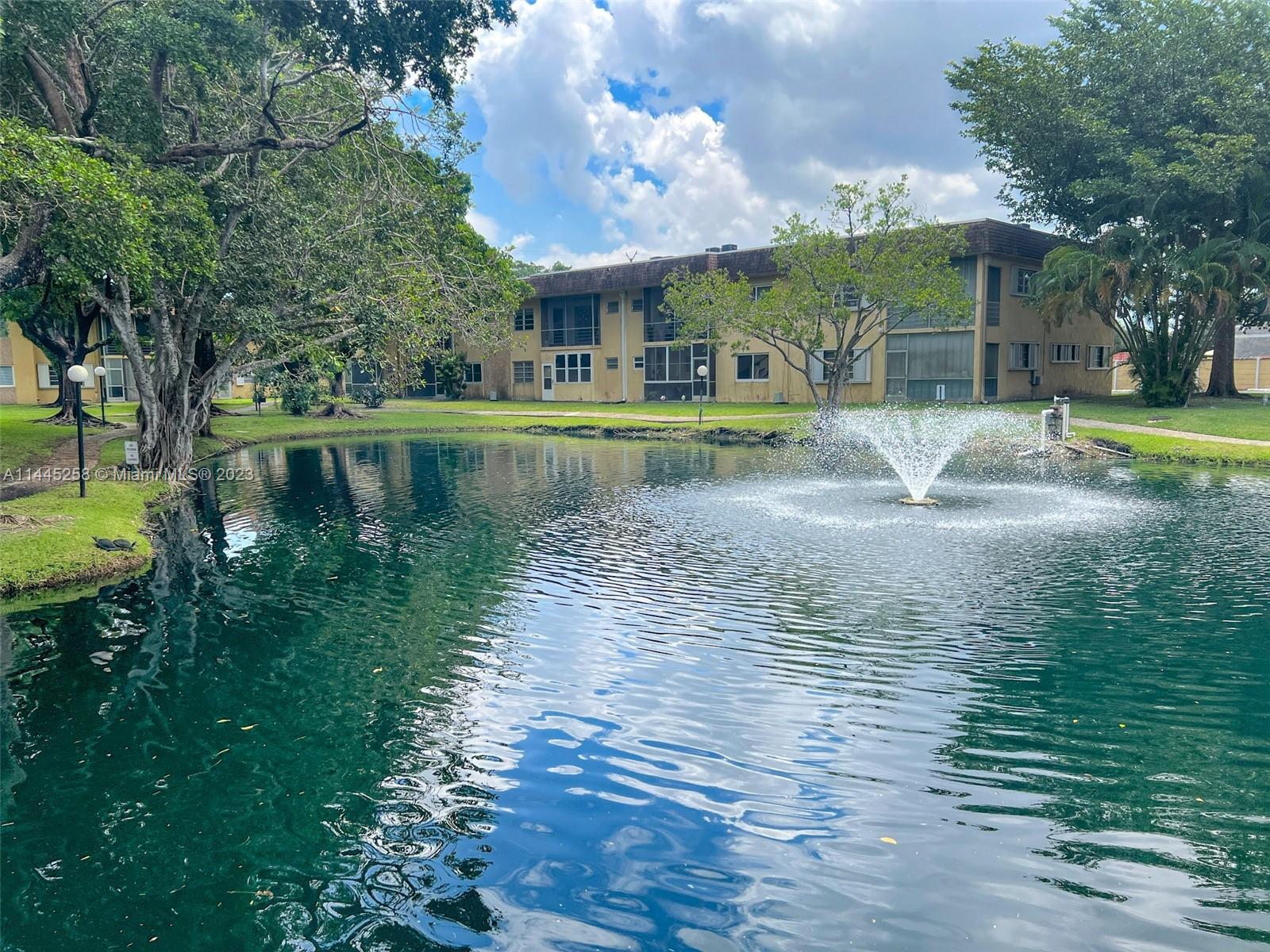 Spacious and well-kept 1/1.5 Lake-view Condo in Oak Hills Community centrally located to all major highways, restaurants, airport, beaches, and the Hard Rock Hotel and Casino. Amazing lake view from living room and bedroom with screened balcony. Assigned parking with plenty of guest parking. The community has a beautiful picnic and BBQ area with a walking trail, heated pool, gazebo, clubhouse, lake, storage area, and laundry room on each floor. Walking distance to house of worship. Association requires 650+ credit to move IN
