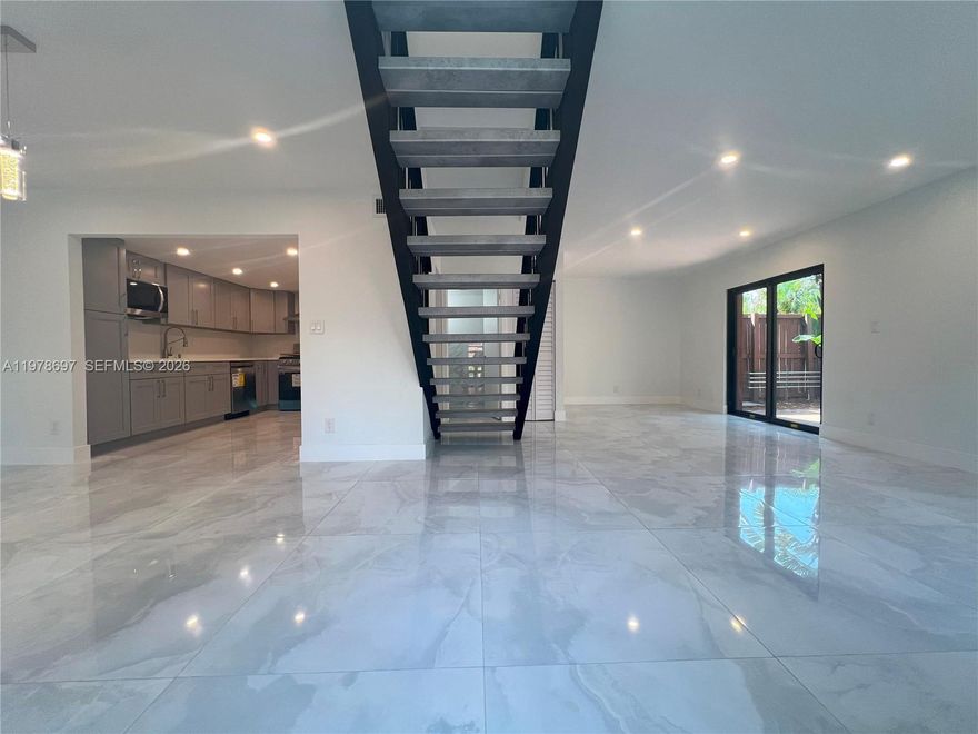 FOR RENT: Two-story townhome with 2 bedrooms (ensuites) / 2 bathrooms, both upstairs and a half bathroom downstairs. This spacious unit was completely remodeled with great taste and luxurious finishes. EVERYTHING has been completely remodeled and caters to those who appreciate the finer things in life. Impact Windows & Doors. Both bedrooms have large walk-in closets and have their private bathroom. Unique to this unit is an enormous wraparound terrace laid out with Chicago-style bricks and uninterrupted garden views. Located in the well-established Snapper Village Community, and centrally located just off 117th Avenue and Sunset Drive, this gated community offers many amenities including a resort-style pool, tennis courts, 24-hour security, and more.