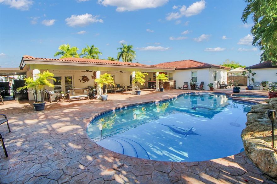 Spacious and versatile, this 4-bedroom, 3-bath pool home with two primary suites offers 2,607 sq ft of living space on a 9,785 sq ft lot. The layout features multiple living areas, including formal living, dining, and a large family room, creating great flow for everyday living and entertaining.

The centrally located kitchen offers wood cabinetry, Corian countertops, a breakfast nook, and opens to the family room. Bedrooms are positioned away from the living areas for added privacy, featuring two primary bedrooms with en-suite bathrooms, along with a cabana bath offering convenient pool access.

Outdoor highlights include a covered patio with bar space, a chlorine pool with shallow ends, a fully fenced yard, and a detached storage shed.

Conveniently located close to shopping, dining, and major highways, this home offers space, function, and versatility in a well-established neighborhood.