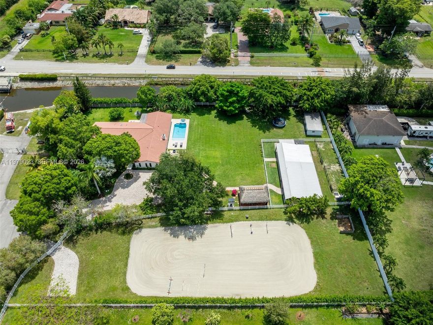 Astonishing House in a private, gated, fully fenced, animal/horse lover's compound in a 2.2 acres lot and 3881 living area. Sitting at the end of the Cul-de-sac. Main house has 4 bedrooms and 4.1/2 bathrooms. Everything has been updated to the higher standards. Porcelain Tile Floors, Subzero and Wolf appliances. Steam shower in master bathroom. Huge Pantry. Costume made interiors doors and closets. New Trane AC units. Wine Cellar. New sprinkler system and New water filtration. Tiki Hut. Pond. Two gates, one for the main house and the other one for the arena. Separate Guest House with 1 bed, 1 bath, living room and kitchen. Barn with 7 stalls with an AC tack room and 1 bath with a total area of 2128 sq feet. Do not this miss this opportunity!