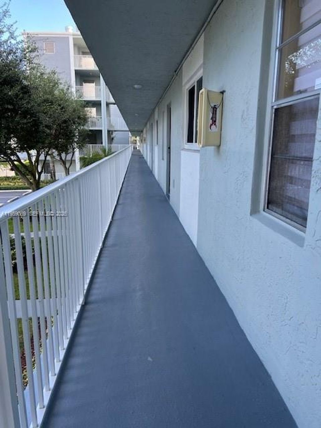 Photo of 2226 N Cypress Bend Dr #210, Pompano Beach, FL 33069 (MLS # A11959089)