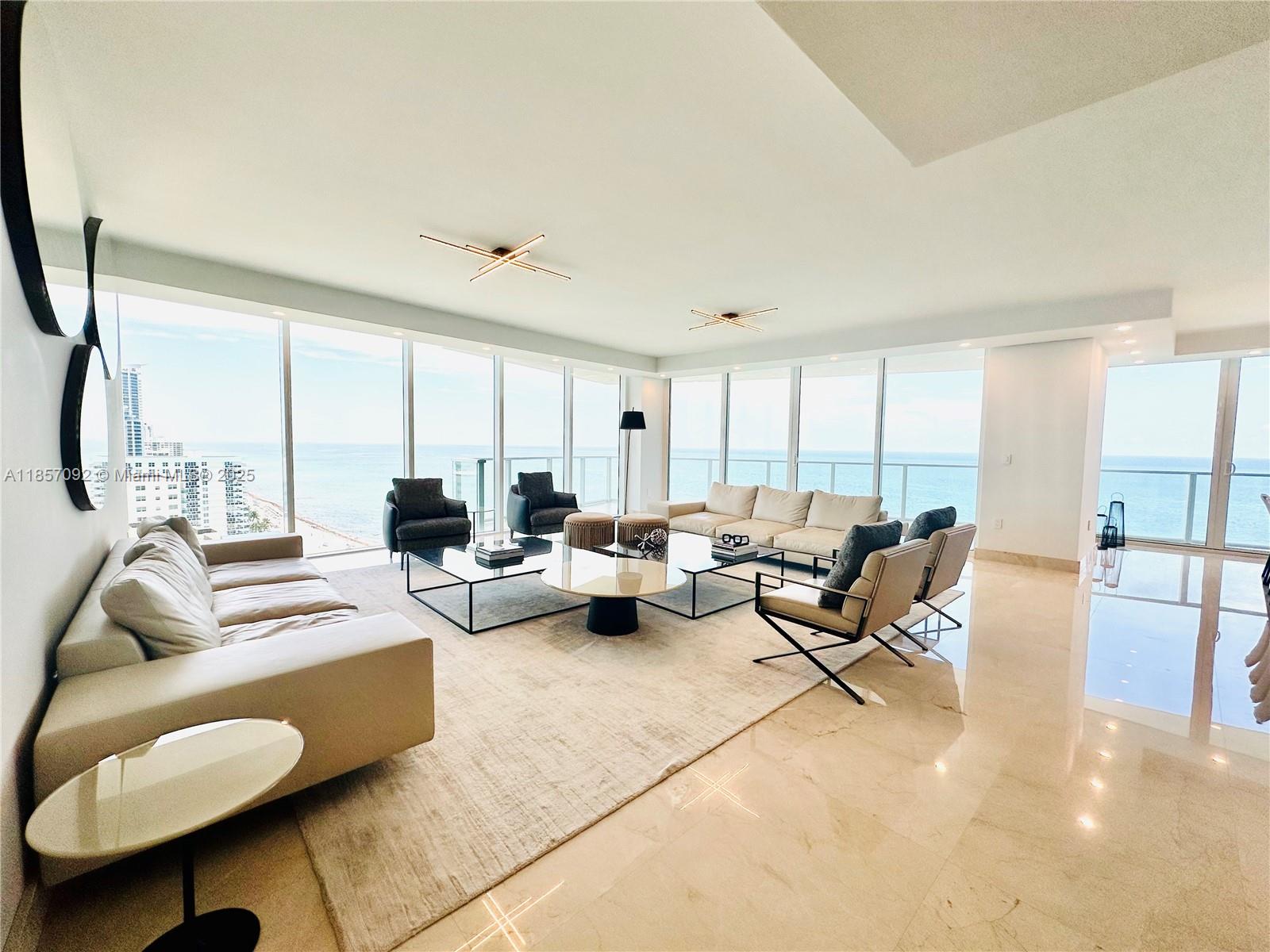 Experience the epitome of oceanfront luxury in this stunning 4-bedroom plus den, 4.5-bath residence offering unobstructed, panoramic ocean views. This turnkey home is elegantly appointed and fully furnished, ready for immediate enjoyment.
The expansive, light-filled floor plan features floor-to-ceiling glass, a gourmet kitchen, and spacious living areas that flow seamlessly onto the spacious balcony. Each bedroom offers en-suite luxury, while the versatile den provides an ideal space for an office, media room, or guest retreat.
The unit includes 3 parking spaces and a private beach cabana, ensuring the ultimate in convenience and exclusivity. Residents enjoy access to world-class amenities and a coveted location on South Ocean Drive, minutes from fine dining, shopping, and entertainment.
