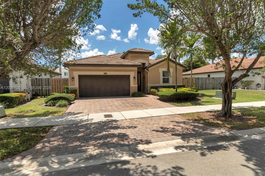Welcome to Hemingway Point! This beautifully upgraded 3-bedroom, 2-bath residence offers 1,684 SF of living space on a 5,550 SF lot and combines comfort, style, and functionality throughout. Built in 2014, this move-in ready home features an open layout with tile flooring throughout, crown molding, tray ceilings in the primary suite, and elegant decorative touches including picture frame molding and chair rail accents in the formal living room and foyer. The kitchen is equipped with stainless steel appliances, all updated within the last 1–3 years, recessed lighting, and ample space for entertaining.

Enjoy added convenience with custom closet organizers, an automatic 2-car garage with insulated garage door and Gladiator storage furniture, security camera system inside and out, and alarm system. The spacious primary suite includes a relaxing jacuzzi tub, while plantation shutters add timeless charm throughout most of the home. Step outside to a covered aluminum patio with ceiling fans, perfect for outdoor dining and gatherings. Additional features include hurricane impact French doors, hurricane shutters, can lighting throughout the main living areas, and soaring 10-foot ceilings in the formal living room and foyer. Conveniently located near major highways, shopping, dining, and schools.