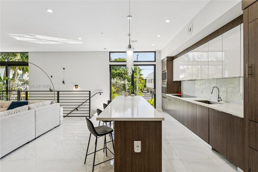 Private, gated townhome in prime Victoria Park location with access to top-rated schools. East-facing & flooded with natural light. Floor-to-ceiling windows and 10’ ceilings. Open-concept main floor, and 3 spacious bedrooms offer endless possibilities—guest suite, nursery, home office—you decide! Home features Chef’s kitchen with built-in Sub-Zero fridge and Wolf induction range, private wrap-around balconies, epoxy-coated 2-car garage and modern finishes throughout. Walk to Holiday Park to watch the Panthers prep for their third Stanley Cup or enjoy tennis, pickleball, ice skating, 2 dog parks and more. Minutes to the beach and Las Olas Blvd’s vibrant dining and boutique shopping—this hidden gem has it all. Schedule your private tour today!