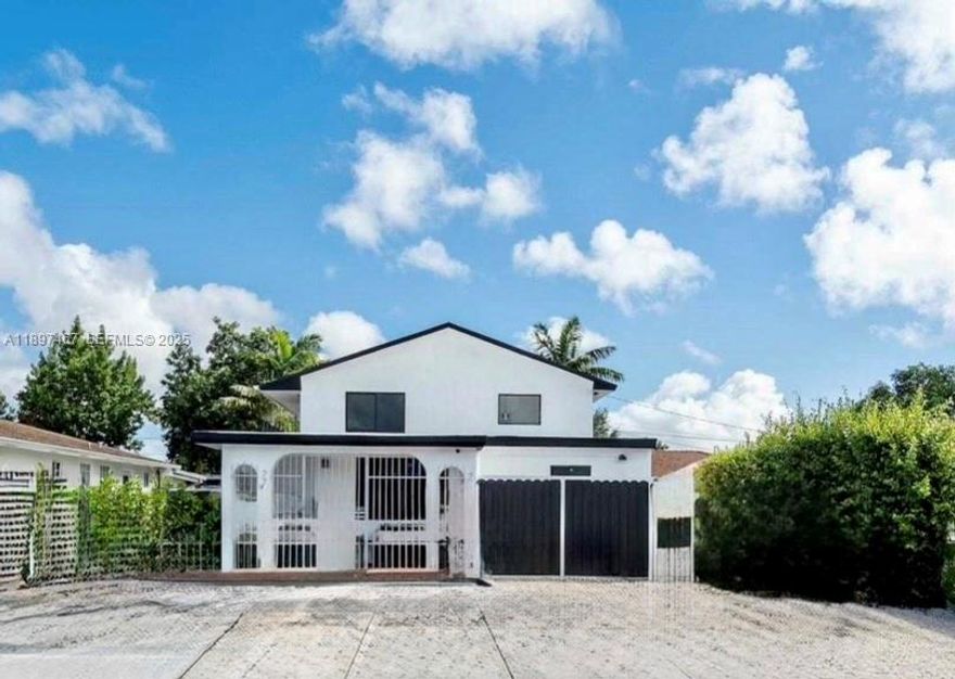 AMAZING LOCATION! This beautiful 5 bedrooms, 2 bathrooms property consisting of 2450 sqft can be used as a income producing rental income property or could be turned into a family dream home. Its convenient central location makes it very easy to navigate to all of Miamis HOT SPOTS (Coral Gables, Coconut Grove, Doral, Wynwood, Miami International Airport, and more) ALL IMPACT WINDOWS. This home has a separate 2 bedrooms , 1 bathroom efficiency (with oven and stove) that is protected by iron gates. The main house is 2 stories consisting of 3 bedrooms and 1 bathroom and has an automatic gate for privacy and security. ROOF 7 YEARS OLD. UPDATED PVC PLUMBING.