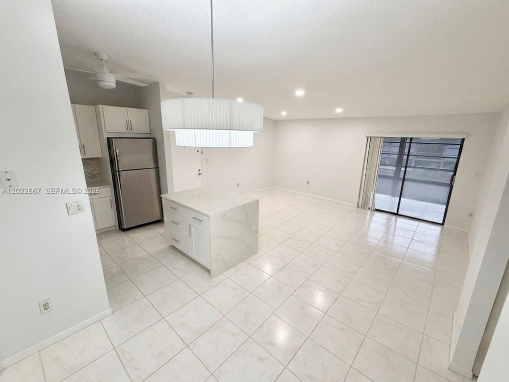 Photo of 7857 Ashmont Cir #213, Tamarac, FL 33321 (MLS # A12022667)