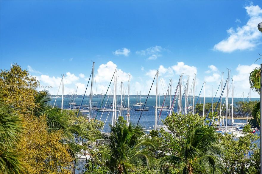 [A Miami Signature Home] ~ Find your nirvana here! Presenting a distinguished combined-unit with serene views of the bay, Dinner Key Marina and the celebrated Coconut Grove landscape. Come sit a spell in the oversized balconies and enjoy the swaying palms and bay breezes while sipping your preferred libation. This rare and grand residence lives like a single-family home but in reality set in the iconic Yacht Harbour-- a Ken Treister-designed treasure. Featuring double-door entry into foyer, a stylish designer kitchen, glamorous baths, flex-space living areas, library, 2 covered parking spaces + 2 storage units. Leave the car behind and stroll to the nearby shoppes, restaurants, theatre, parks, market and the illustrious bayfront. The living is easy and unhurried here. Nirvana...found.