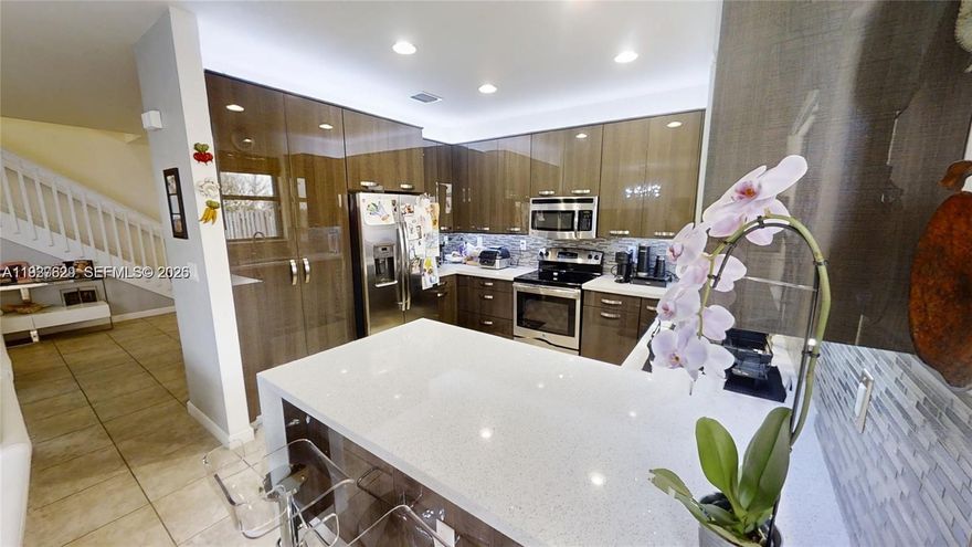 Two Story 3/2/1 townhouse on a quiet lake view street. Wonderfully maintained 2016 construction & upgrades to kitchen, flooring, & patio. Master bedroom boasts tray style high ceilings & oversized walk-in closet. Master bath dual sinks + separate tub & shower. Open layout 1st floor with guest bath & room for formal dining, living room & kitchen entertaining areas. Wide-spacious staircase upstairs to split-plan master separated from 2nd & 3rd bedrooms & washer/dryer closet. Covered back patio with ceiling fans & plenty of sun area to garden & grill. Lake & sunset views in front of home. Resident pool at gated clubhouse overlooking scenic lake. 2 car garage plus space to park 2-3 vehicles in driveway. HOA covers landscaping & funding for reserves. Impact glass & shutters. Tile roof