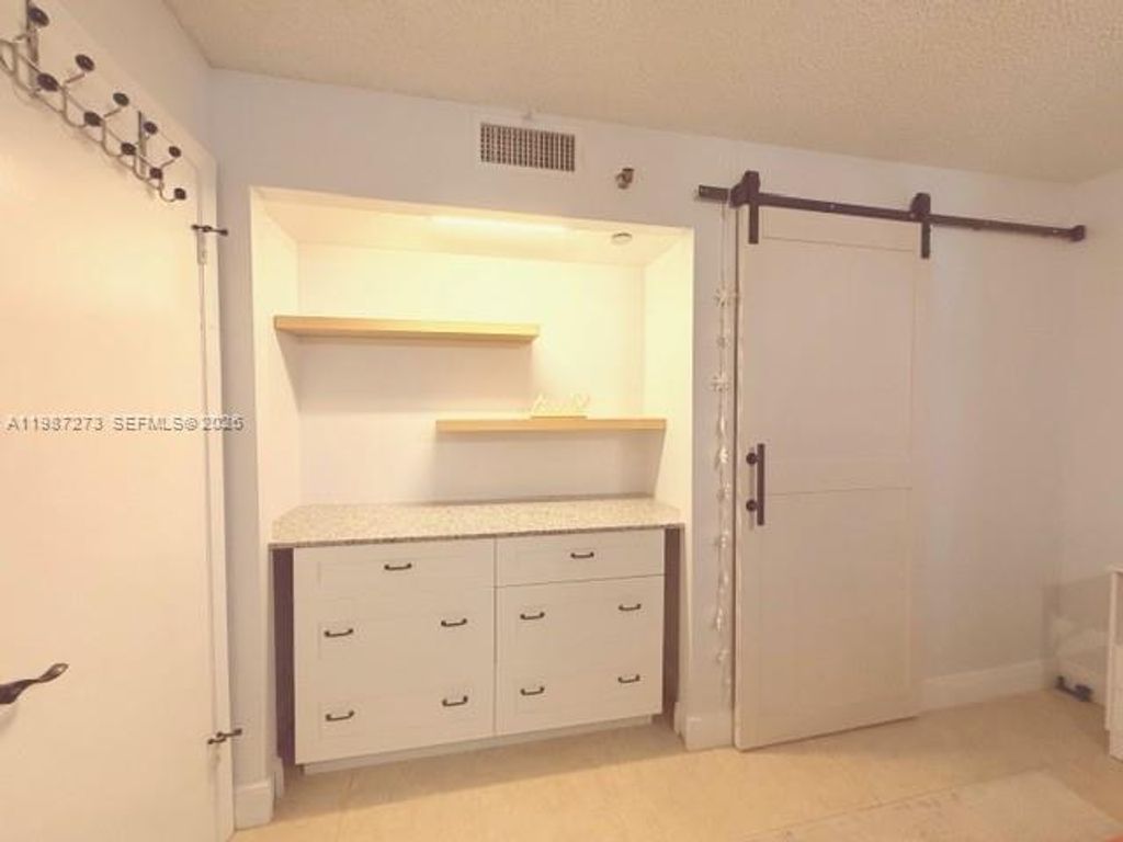 Photo of 1100 Saint Charles Pl #L6, Pembroke Pines, FL 33026 (MLS # A11987273)