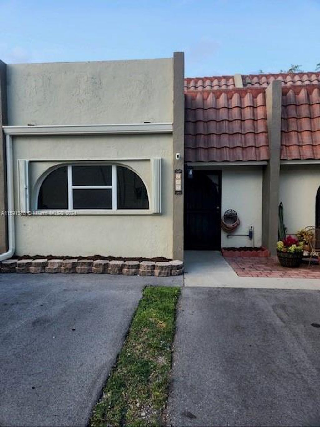 Photo of 203 Jacaranda Dr #7, Plantation, FL 33324 (MLS # A11591310)