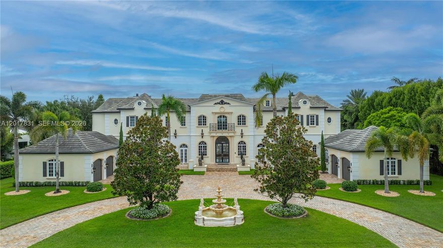 Welcome to "Bella Maison", a 2-story estate in the gated community of Windmill Reserve, Weston FL.8BR/8FB/2HB, 4-car garage, Travertine circular driveway, on protected natural preserve w/ western sunsets.Marble & wood flooring, incredible gourmet kitchen, large island, walk-in pantry, granite, Wolf gas range & high-end appliances, 2 new Bosch dishwashers. Featuring home theater, game room, gym, elevator, bar/billiards room,office study, sunroom, up/down laundry rooms, 5 marble fireplaces & impact glass and doors. Owner's suite w/vast walk-in closets. French-renaissance style w/hand-painted artistry, crown moldings, gold/silver leaf foil &murals, 3 balconies, 2 fountains, decorated lions, lush landscape, heated pool & spa. *New roof in 2015. *5 newA/C units. This home is a must-see!