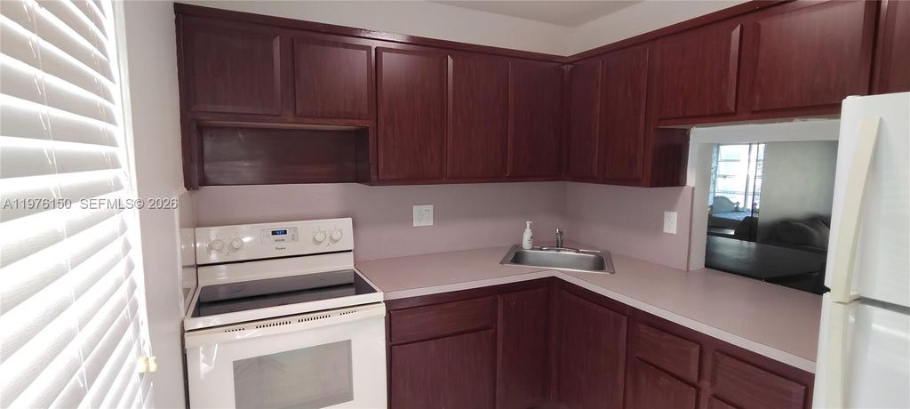 Photo of 6090 NW 64th Ave #306, Tamarac, FL 33319 (MLS # A11976150)