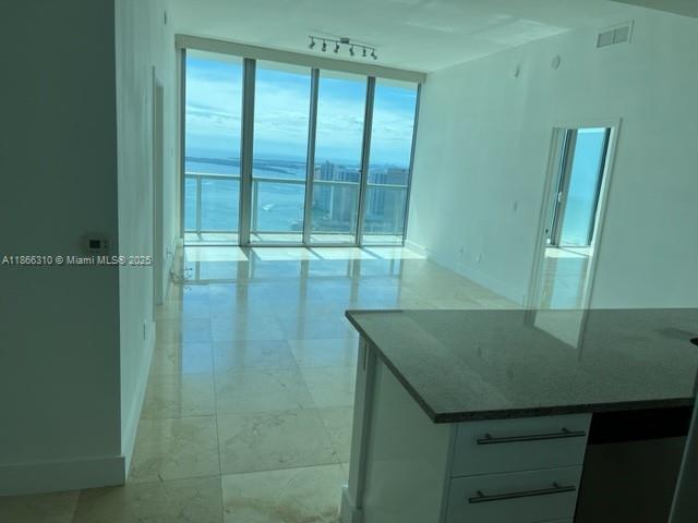 Breathtaking, unobstructed views of Biscayne Bay and the sparkling Miami Beach skyline — day and night. A stunning 2-bedroom, 2.5-bath residence with a rare and privileged layout that sets it apart from others in the building.
This high-floor unit features floor-to-ceiling windows throughout, flooding the space with natural light and showcasing panoramic water and city views from every room. At night, enjoy the magic of Miami's skyline lit up across the bay — a true visual masterpiece.
Designed with both elegance and functionality in mind, the unit offers an open-concept kitchen with stainless steel appliances, spacious living and dining areas.
Marina Blue is one of Downtown Miami’s most desirable buildings, ideally located directly across from Bayfront Park and the Kaseya Center