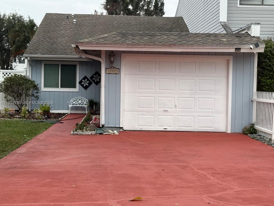 Large 2/2 Villa with additional den that can be used as 3rd bedroom in the well sought after Wellington area with tiled floors throughout, manicured garden with lots of fruit trees, screened patio, fenced yard, ample parking space plus 1 car garage.
