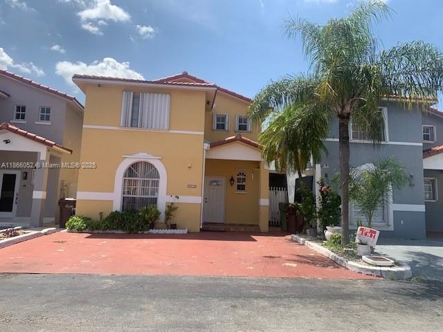 We feature this very comfortable Hialeah townhouse!! 3 beds & 2 baths, and beautiful tile flooring throughout, this home boasts a lovely kitchen with granite countertops and stainless-steel appliances. The layout includes a convenient ground-floor bedroom and bathroom, with two additional bedrooms and a bathroom on the second floor. The second floor also has a washer and dryer for added convenience. Enjoy outdoor gatherings on the covered patio and take advantage of the driveway that may fit 3 cars. Located in a tranquil neighborhood, this property is just minutes away from Palmetto Hospital, expressways, major shopping centers, malls, and top-rated schools. Don't miss out on this perfect blend of style and location! No pets, please!
