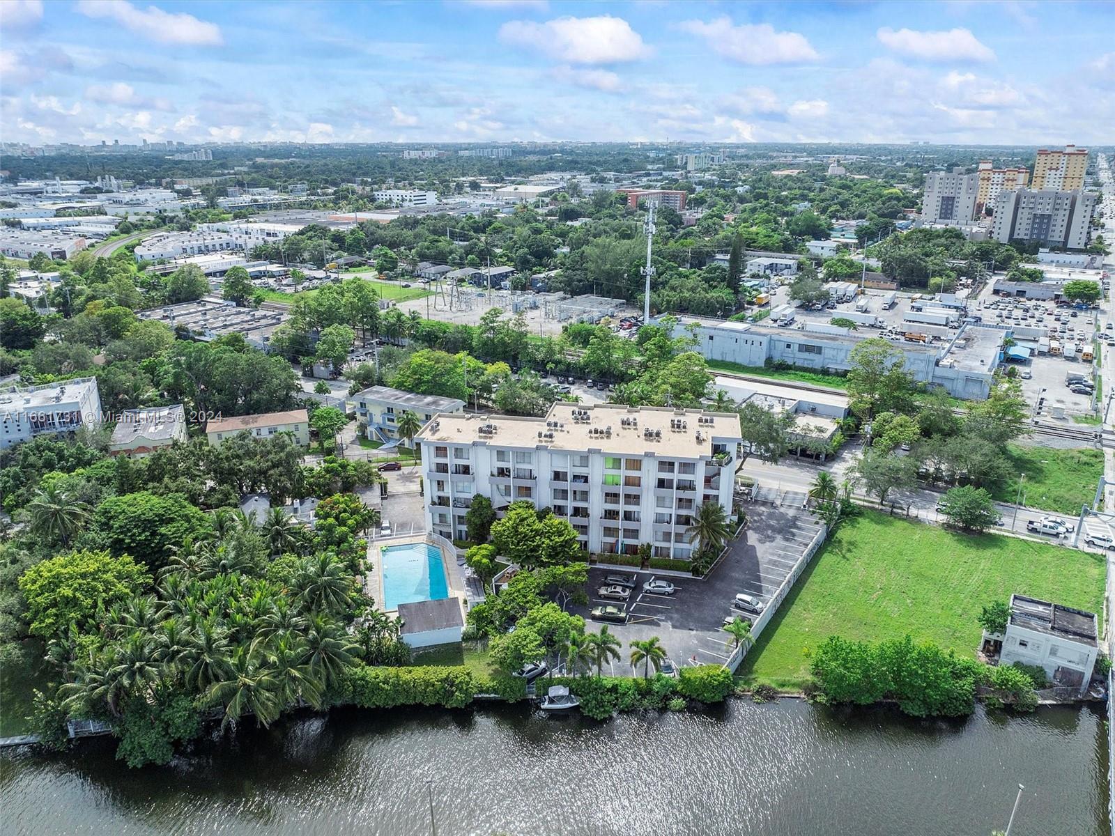 Access to the ocean from the building, opportunity to install a jetski floating dock or space for a small boat, currently at no charge. Large, bright, 2-level unit with ample closets, balcony, and assigned parking space. Option to install a W/D in the unit. Very large primary bdrm with a walk-in closet. Amenities to enjoy are a lap-sized swimming pool, BBQ, sauna, garden, and guest parking in a gated community. Near parks, coffee shops, and restaurants. A quick drive down 79th to the beach.