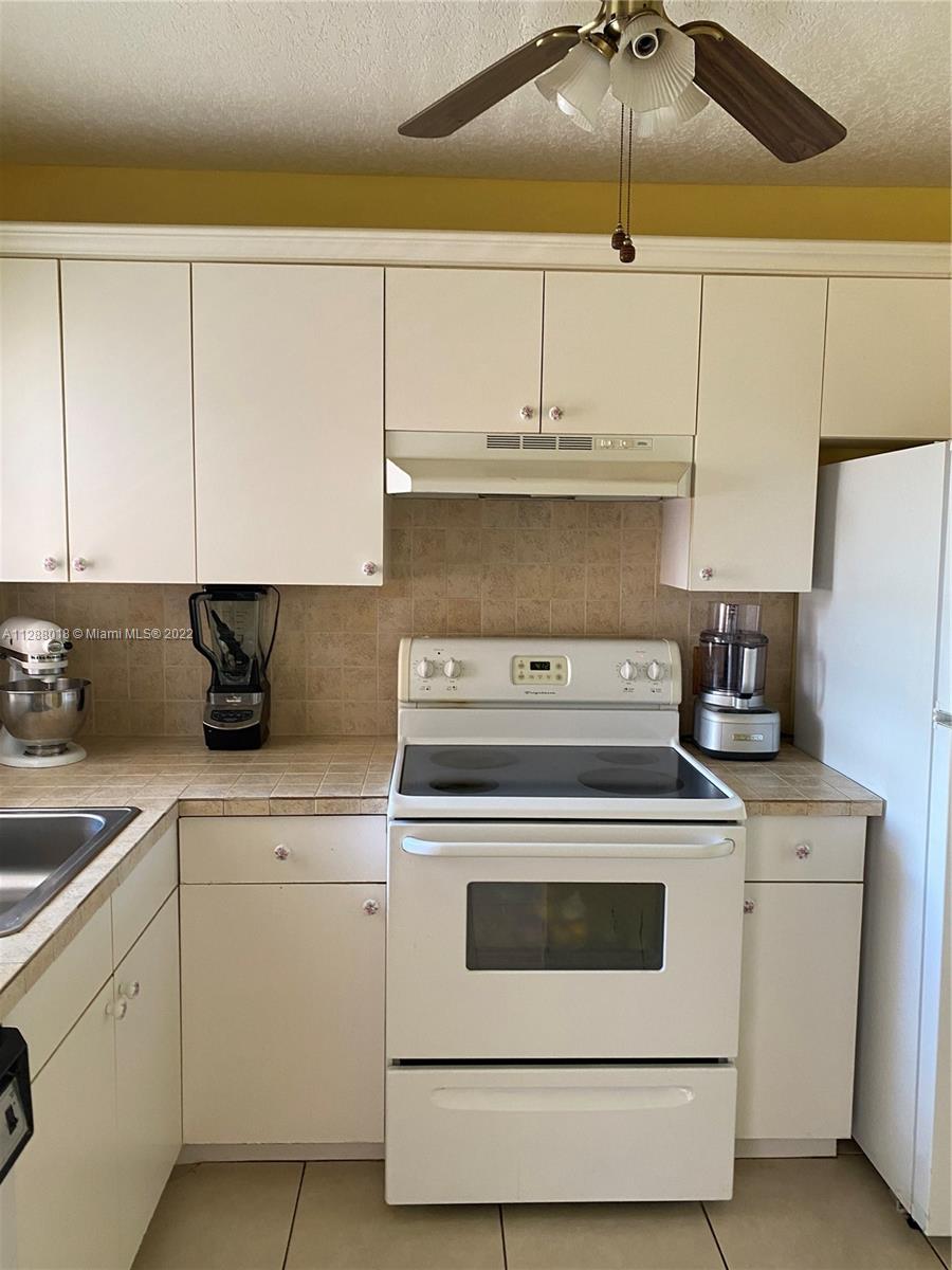 Beautiful, 2/2 condo with an amazing view of the canal/garden. Very bright corner unit with lots of natural light (1 additional window in the bedrooms). Located in the well maintained 55+ community of Sunrise Lakes. Partially remodeled kitchen and bathrooms. Impact windows in patio and kitchen. Tile throughout. This active community has a Club House that offers multiple amenities like: golf course, two tennis courts, heated pool, gym, theater, billiard room, courtesy bus and more. Excellent location close to major roads, public transportation, restaurants and main shopping centers. Come enjoy the Florida lifestyle.