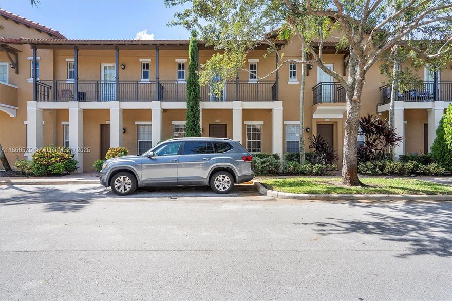 THIS MODERN TOWNHOUSE BOASTS 10 FT CEILINGS, ENERGY-EFFICIENT LED LIGHTING THROUGHOUT, AND 2 PRIMARY BEDROOMS, EACH WITH PRIVATE BATHS & CLOSETS. ENJOY A NEWLY INSTALLED A/C SYSTEM (2022) FOR YEAR-ROUND COMFORT. SPACIOUS GREAT ROOM, CURRENTLY USED AS A LIVING ROOM, IDEAL FOR FLEXIBLE USE AS A HOME OFFICE, GUEST AREA, OR POTENTIAL THIRD SLEEPING SPACE WITH A STYLISH BARN DOOR ADDITION FOR PRIVACY (NOTE: NO BUILT-IN CLOSET). REAR PRIVATE PARKING PAD WITHIN THE HOME'S PREMISES WITH CONVENIENT BACK ENTRY, PLUS GUEST PARKING. HOA OF ONLY $454 MONTHLY INCLUDES: CABLE, INTERNET, ALARM, 24/7 SECURITY, AND GATED ENTRY WITH NO ADDITIONAL ASSESSMENTS. COMMUNITY OFFERS HEATED POOL, GYM, AND SEVERAL PARKS.  LOCATION! WALK TO VIBRANT PLAZA W/WHOLE FOODS, RESTAURANTS, AND MORE. PERFECT AREA FOR FAMILIES.