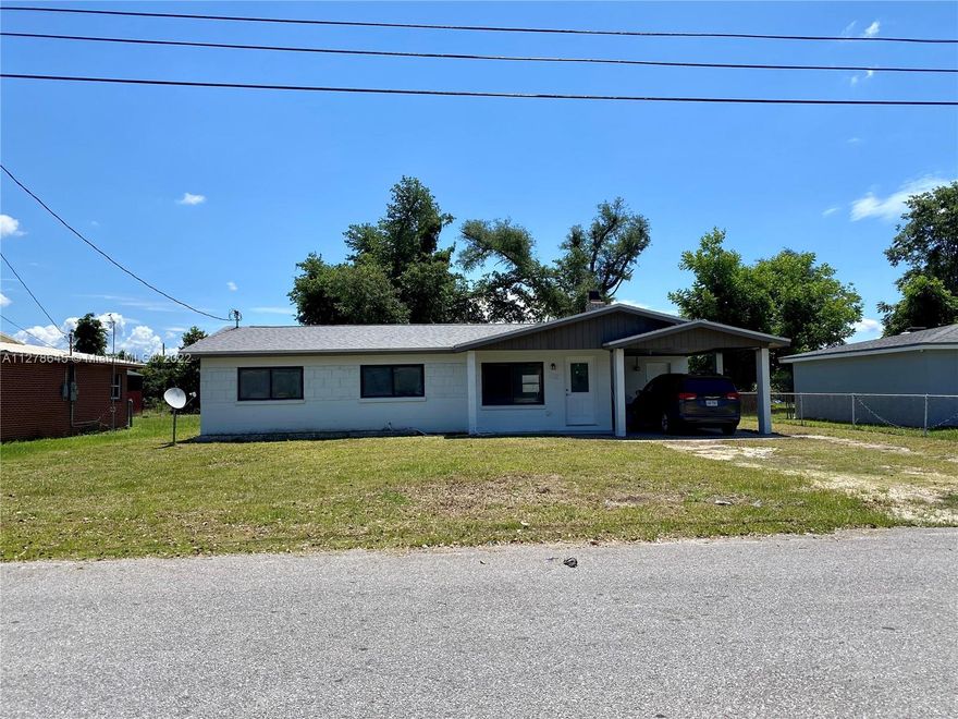 Amazing home COMPLETELY REMODELED 4 bedroom, 2 bathroom home situated on a peaceful street close to everything, super market, military base, School, pharmacy etc. . This home has a recently replaced roof, A/C and ducts, new electricity panel and complete wired, spacious modern Italian kitchen and open living room with new appliances, spectacular  24 x 48 Spain Porcelain tile in the entire home except rooms, rooms has beautiful waterproof laminate, The living room and hallway features recessed lighting. Lots of possibilities with this newly renovated home on a large  lot with covered parking and extra storage.