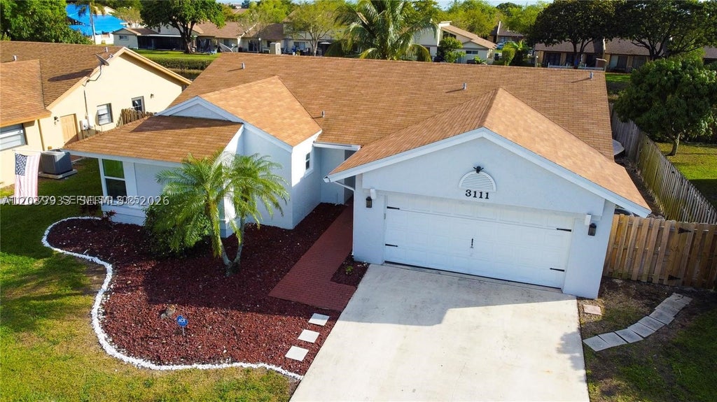 Photo of 3111 NW 107th Dr, Sunrise, FL 33351 (MLS # A12039933)
