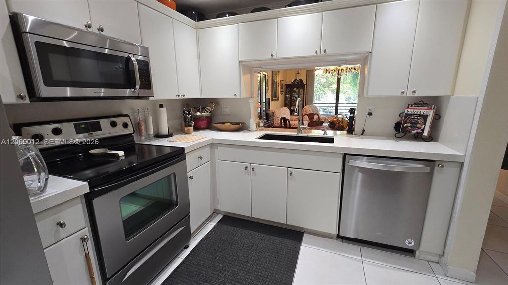Photo of 1101 Colony Point Cir #218, Pembroke Pines, FL 33026 (MLS # A12009012)