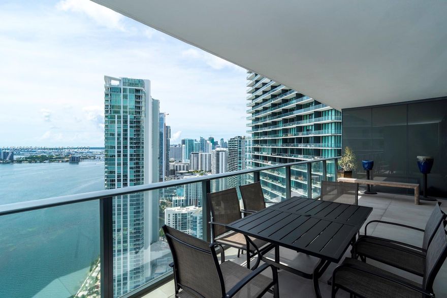Stunning furnished 2 Bed + Den / 2 Bath condo at Paraiso Bay with direct, unobstructed views of Biscayne Bay. This spacious residence features an open layout, modern kitchen with island, and a large private balcony perfect for entertaining. Master suite includes glass-enclosed shower and elegant finishes. Enjoy private foyer access with exclusive elevator entry. Five-star amenities include a massive 100-ft diameter pool, full gym, spa, wine cellar, cigar lounge, two tennis courts, and more. A true luxury lifestyle in Edgewater!