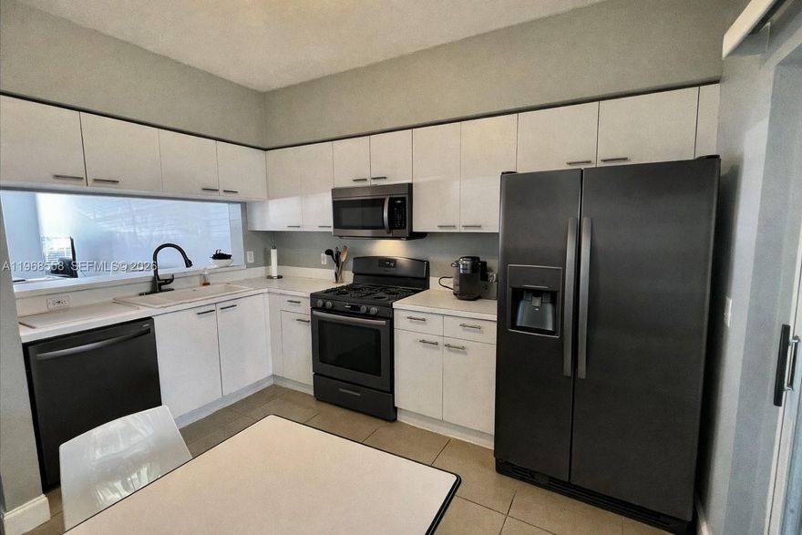 Corner Unit! Experience South Florida lifestyle in this charming Key West-style townhome nestled in the highly sought-after, meticulously maintained community of Sanibel in Tamarac. This exceptional corner-lot residence offers a perfect blend of comfort and style, featuring a spacious two-bedroom, 1.5 -bathroom layout that maximizes its 1,110 square feet of air-conditioned living space. As you step inside, you are greeted by an inviting open-concept living and dining area, perfectly complemented by warm wood flooring and abundant natural light that flows through the home. The kitchen is a chef's delight, equipped with modern new appliances and ample custom cabinetry, making meal preparation a breeze. One of the standout features of this home is the expansive primary suite, which includes a Jack-and-Jill style bathroom featuring a luxurious Roman tub and dual sinks, providing a spa-like retreat at the end of a long day. Outside, your private, screened-in patio awaits—complete with a storage closet—offering the ideal spot for morning coffee or evening relaxation while enjoying the peaceful garden views. Living in Sanibel means access to premium resort-style amenities, including a massive swimming pool, tennis courts, a sand volleyball court, basketball courts, and a playground, all surrounded by scenic trails and lush parks.