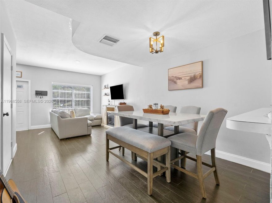 Corner Unit! Experience South Florida lifestyle in this charming Key West-style townhome nestled in the highly sought-after, meticulously maintained community of Sanibel in Tamarac. This exceptional corner-lot residence offers a perfect blend of comfort and style, featuring a spacious two-bedroom, 1.5 -bathroom layout that maximizes its 1,110 square feet of air-conditioned living space. As you step inside, you are greeted by an inviting open-concept living and dining area, perfectly complemented by warm wood flooring and abundant natural light that flows through the home. The kitchen is a chef's delight, equipped with some modern new appliances and ample custom cabinetry, making meal preparation a breeze. One of the standout features of this home is the expansive primary suite, which includes a Jack-and-Jill style bathroom featuring a luxurious Roman tub and dual sinks, providing a spa-like retreat at the end of a long day. Outside, your private, screened-in patio awaits—complete with a storage closet—offering the ideal spot for morning coffee or evening relaxation while enjoying the peaceful garden views. Living in Sanibel means access to premium resort-style amenities, including a massive swimming pool, tennis courts, a sand volleyball court, basketball courts, and a playground, all surrounded by scenic trails and lush parks.