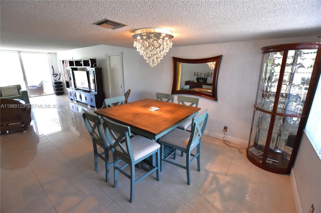 Photo of 3800 Oaks Clubhouse Dr #309, Pompano Beach, FL 33069 (MLS # A11989123)