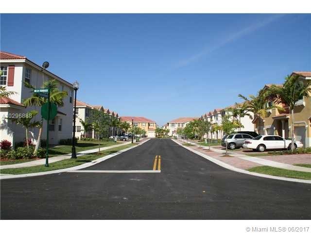 BEAUTIFUL 4 BEDROOM, 2.5 BATH, TWO STORY SPACIOUS TOWNHOUSE, OPEN KITCHEN, FAMILY ROOM, DINING ROO, ONE COVERED CAR GARAGE, WOOD LAMINATE FLOOR IN THE SECOND FLOOR AND TILE IN THE FIRST FLOOR, FULL SIZE WASHER AND DRYER, BACK YARD, SWIMMING POOL AND SECURITY GUARD IN THE COMMUNITY. BUILD IN 2006, CLOSE TO A+ SCHOOL, TURNPIKE AND MUCH MORE.
