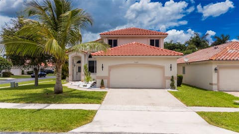 Photo of 7569 Parkside Ln, Margate, FL 33063 (MLS # A12049995)