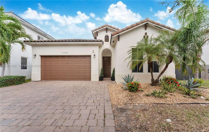 Welcome to Venetian Parc, one of Miami’s most desirable communities. This beautifully maintained 3 bedroom & 3 full bathroom home offers 1,980 sq ft under air and 2,405 total sq ft, sitting on an 7,216 sq ft lot w/ ample room for an RV or boat. Built in 2015, the home features an open-concept layout w/ a split-bedroom design, high ceilings & large windows that flood the space w/ natural light. The island kitchen is perfect for gatherings, complete w/ granite countertops & stainless steel appliances. A built-in wet bar elevates the entertainment experience. Step into your private outdoor retreat featuring a saltwater pool, a paved & fenced backyard & a pergola w/ a translucent roof panel, ideal for year-round lounging. The spacious primary suite includes an en-suite bath w/ tub & glass-enclosed shower plus an upgraded California Closet system & custom built-in wall closet. Additional storage continues in the 2-car garage, enhanced w/ epoxy flooring, overhead storage & an EV charger. Porcelain tile throughout, laundry room, ceiling fans in all rooms, alarm system & exterior cameras, driveway parking for 4 cars. Impact Windows & Doors. HOA only $225/mo. Close to Turnpike, hospitals, shopping, restaurants, Costco, Publix, Home Depot etc. Zoned for Top-Rated schools. Residents of Venetian Parc can enjoy a community clubhouse, resort-style pool, indoor fitness center and more.