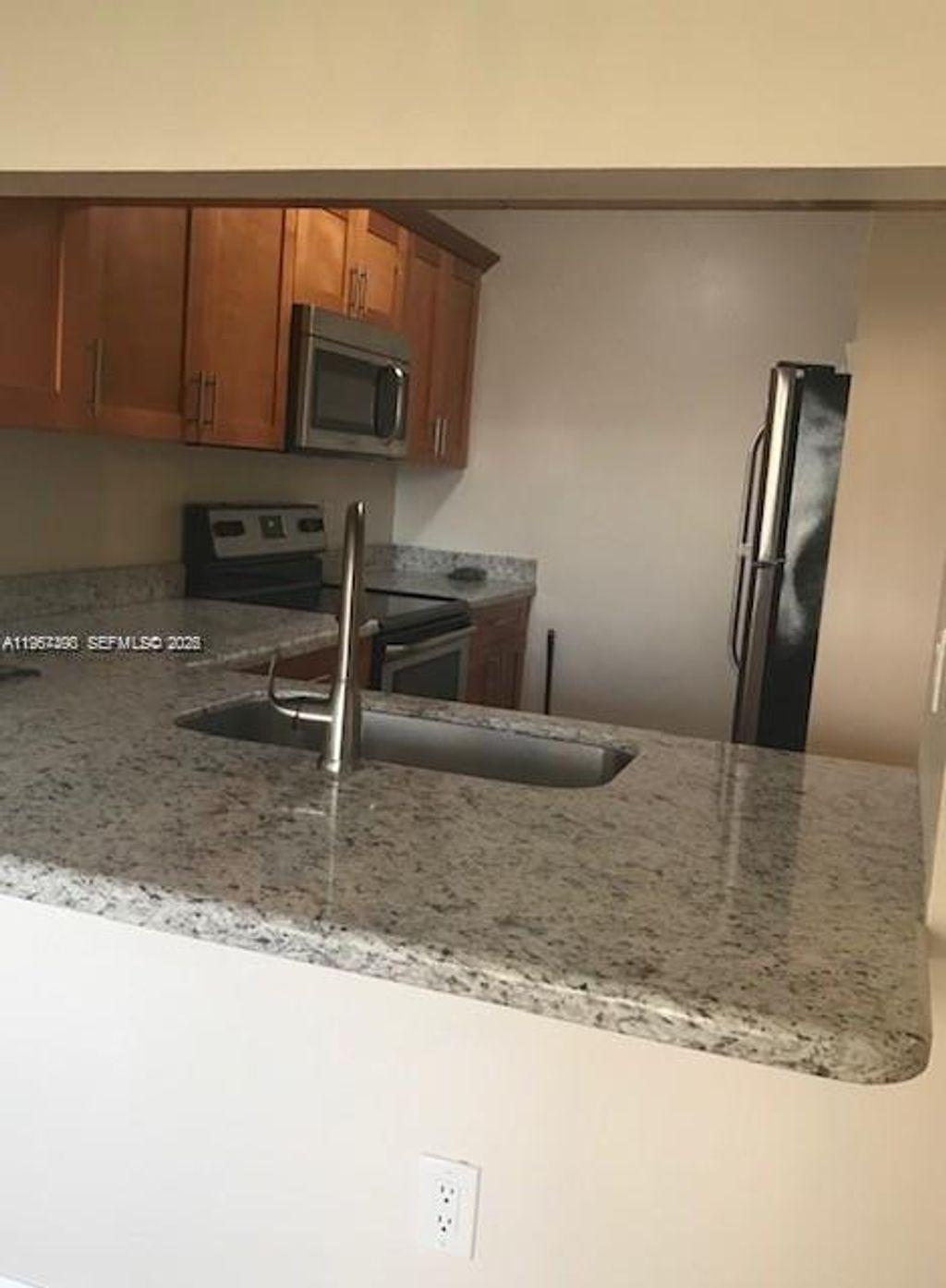 Photo of 10018 NW 4th St #203, Pembroke Pines, FL 33024 (MLS # A11967390)