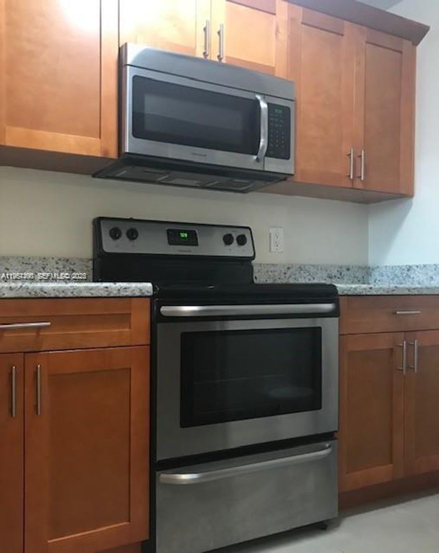 RENOVATED 2 BEDROOMS /2 BATHROOMS CONDO AT PEMBROKE PINES. WOOD KITCHEN CABINETS WITH GRANITE COUNTER TOPS.FRESHLY PAINTED. STAINLESS STEEL APPLIANCES.WASHER AND DRYER INSIDE THE UNIT. FRESHLY PAINTED. TILE FLOORS. ACCORDIAN HURRICANE SHUTTERS. GREAT LOCATION NEAR SCHOOLS,SHOPPING CENTERS AND RESTAURANTS