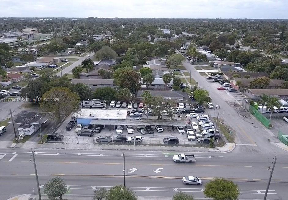 Excellent income-producing property! Great for investors or future redevelopment! CURRENTLY LEASED PRODUCING $144,000 with increases per annum. Current use is a Car Lot with 185 ft of frontage on SW 27th Ave. 1575 Sq Ft Office Building with a fenced lot with dual gates. Current zoning allows for endless development possibilities. SEE ATTACHED RENT ROLL
