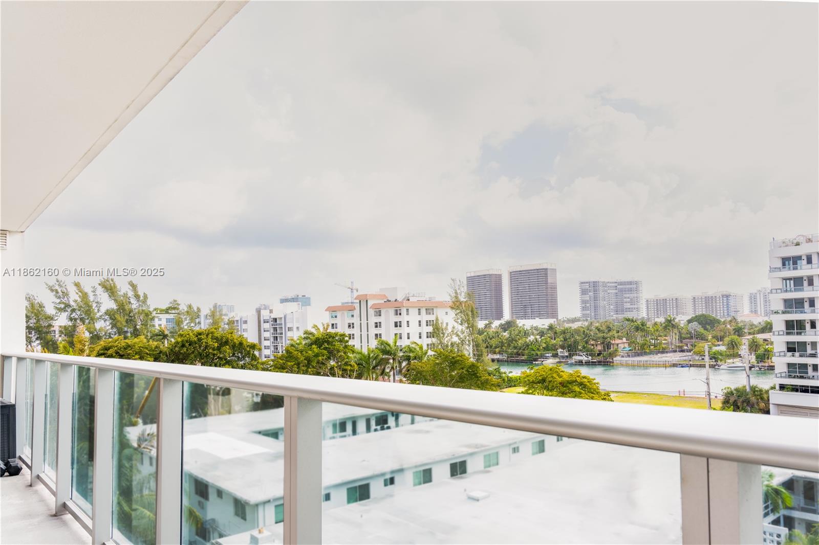 Gorgeous 2/2 plus den in the heart of exclusive Bay Harbor Islands! Like new, split plan with amazing views to the canal! State of the art building with a rooftop that will leave you breathless! Move in ready. Must see!