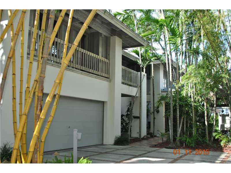 Spectacular Polynesian Paradise Resort in Exclusive Private Coconut Grove Gated Community. Romantic "Casablanca" Master Suite, Plus 4 Bedrooms & Library/Den, 20 Ft. Volume Ceiling in Entry, Amazing Natural Sunlight Thru-Out, Black Limestone Floors and Dra matic Staircase. Renovated Kitchen with Onyx Tiles, Huge Outside Entertainment Pavilion with separate BBQ area Overlooking Pool and Canal. Bay/Ocean access with No Bridges. Impact Windows
