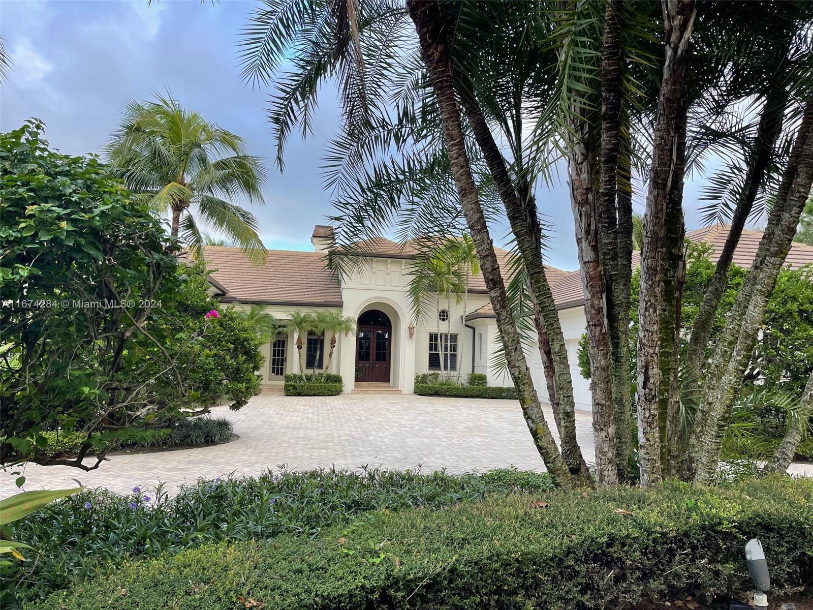 Located in the prestigious gated community of Old Marsh, this residence offers direct views of the 18-hole Pete Dye golf course. Featuring a well-designed split-bedroom floor plan, the home boasts 4 spacious bedrooms and 4 full baths. The recently upgraded gourmet kitchen, equipped with high-end appliances, opens into a large family room, perfect for both entertaining and relaxed living. The spacious living room, complete with coffered ceilings and fireplace, adds a touch of warmth and sophistication. The expansive primary suite is a true retreat, featuring tray ceilings, sitting area, 2 large walk-in closets, dual vanities, jetted tub, and a separate shower. Additional highlights include a dedicated office space, 3-car garage, screened patio with pool, spa, and outdoor kitchen.