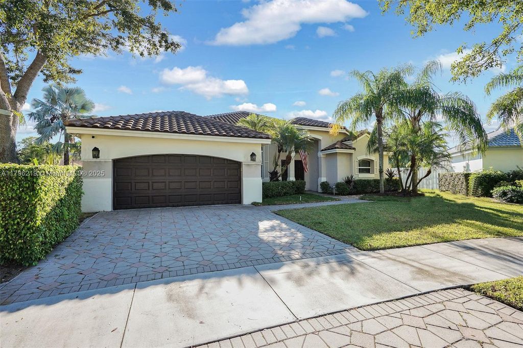 Photo of 648 Lake Blvd, Weston, FL 33326 (MLS # A11796219)